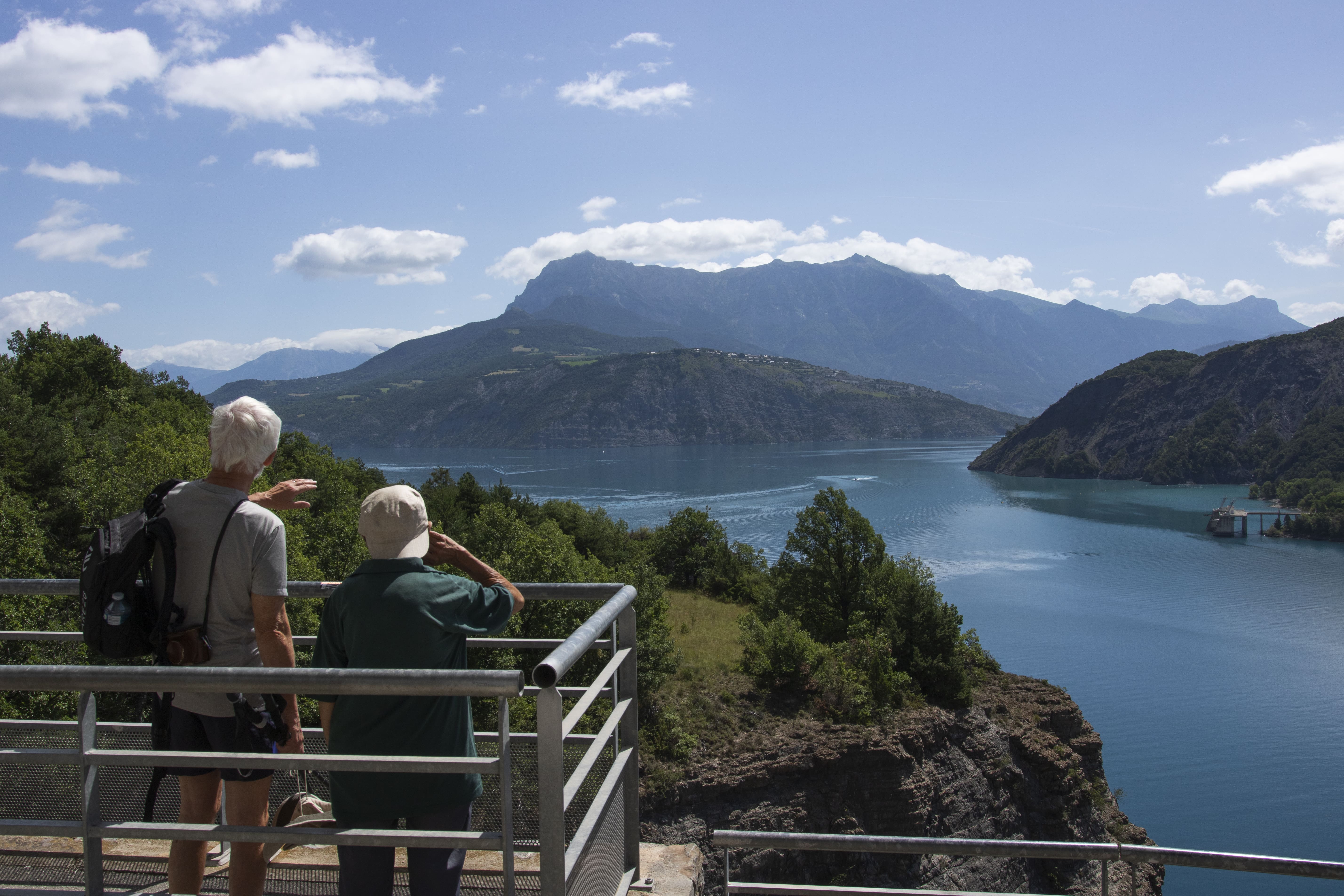 Two travellers enjoying views of the French Alps