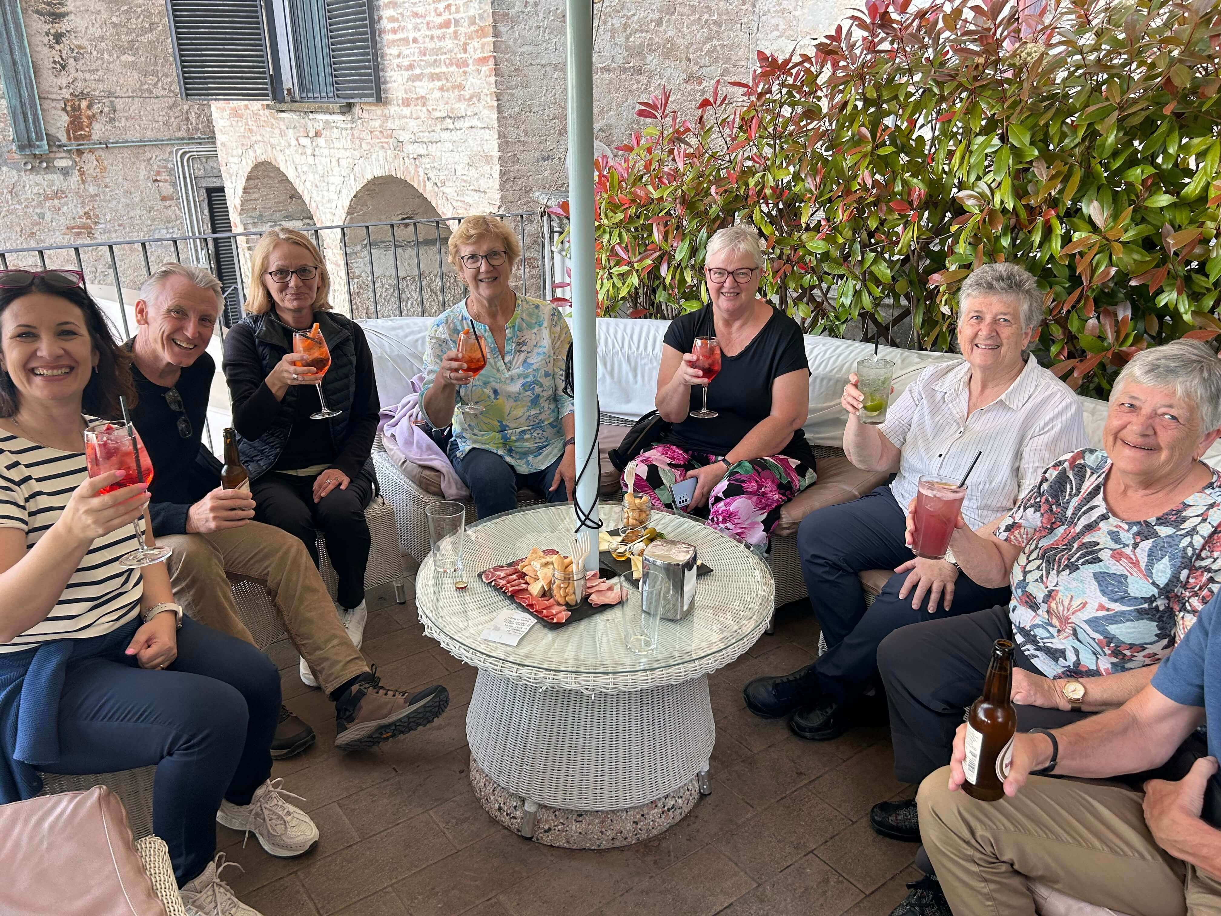Group of travellers having drinks in Italy