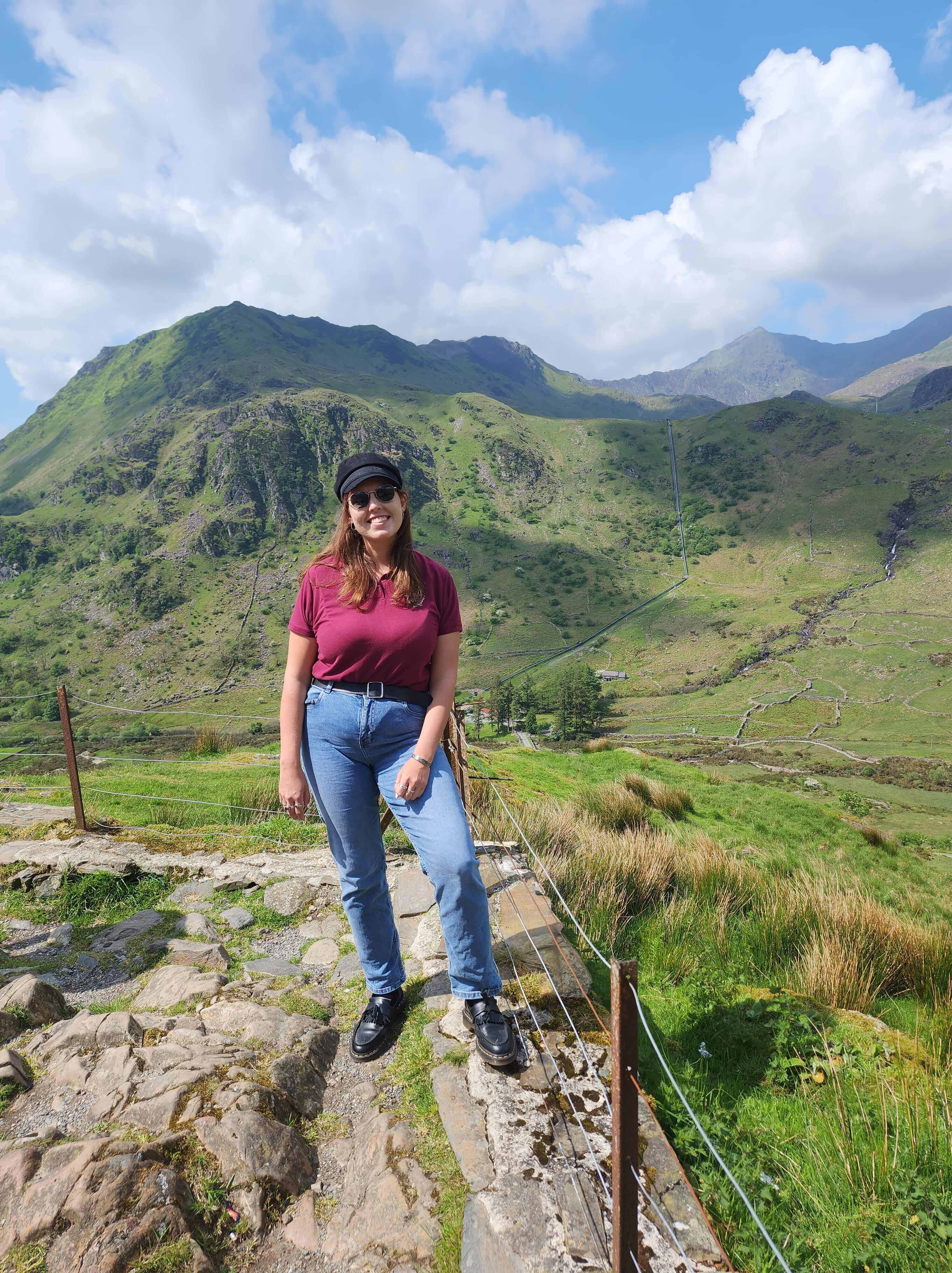 Woman posing by the mountains in Britain