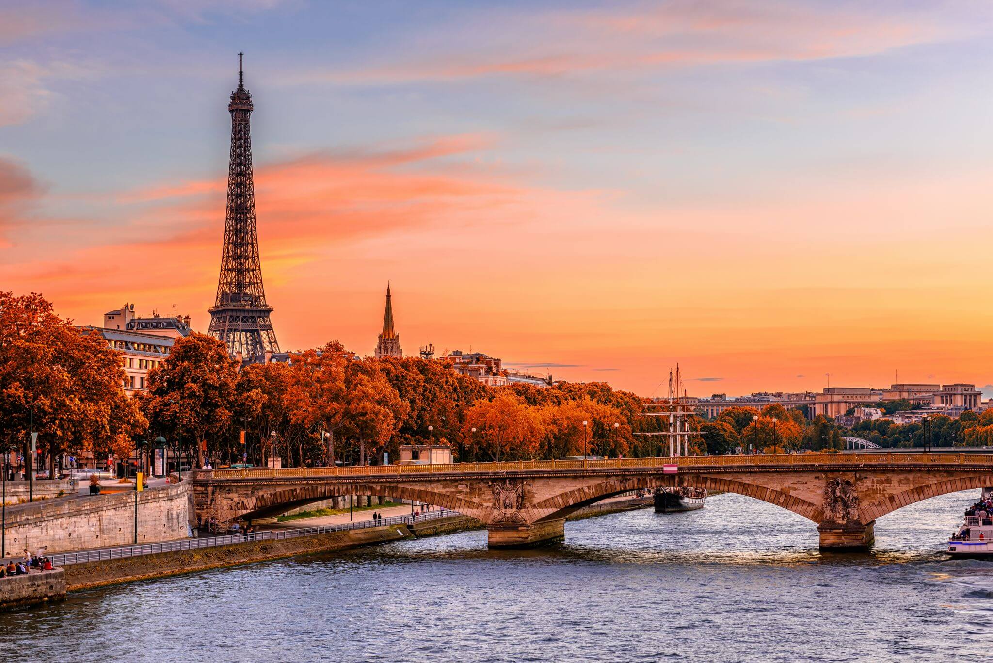 View of the Eiffel Tower and River Seine in autumn at sunset