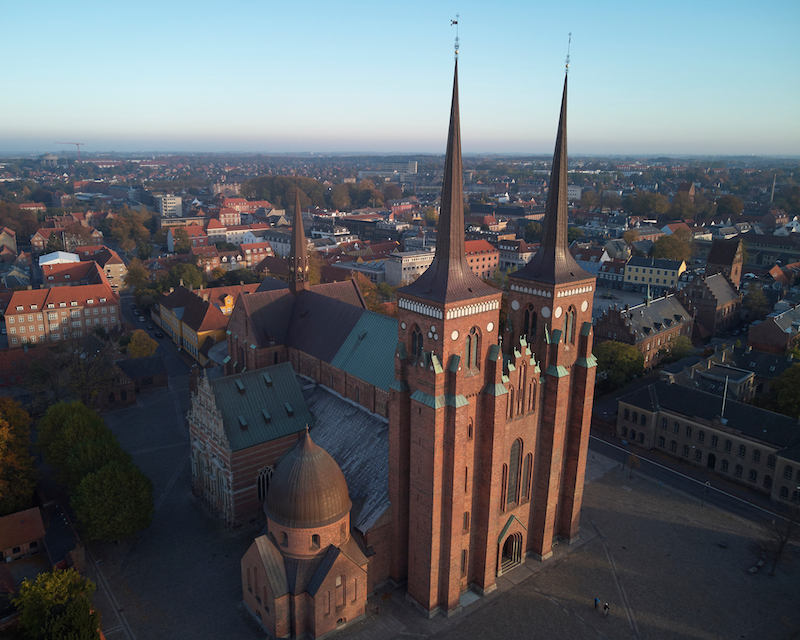 an aerial view of Roskilde Cathedral, Denmark