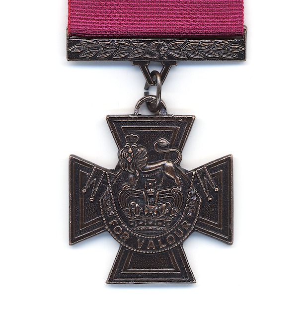 close up of a Victoria Cross medal on a plain white background