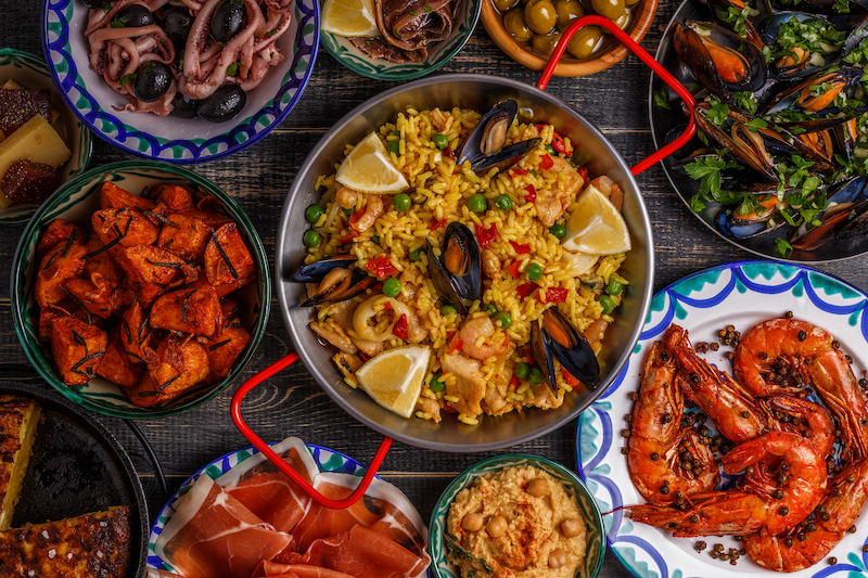 collection of Spanish tapas dishes on a table