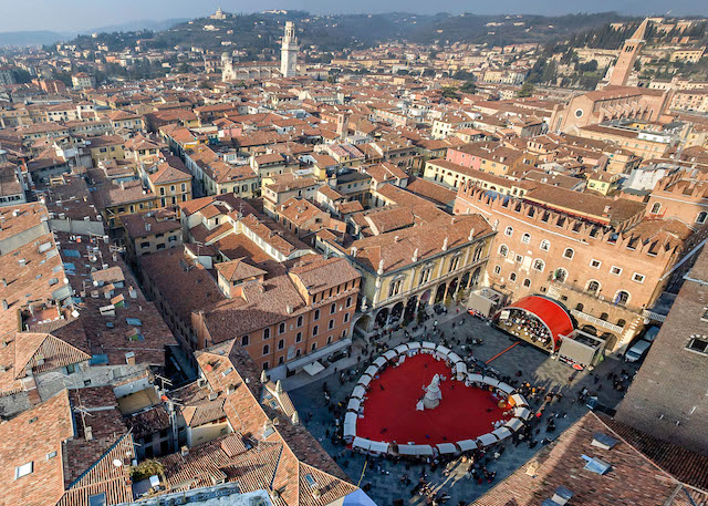 drone view of Verona with a heart shaped Valentine's Day market in the main square Piazza dei Signori