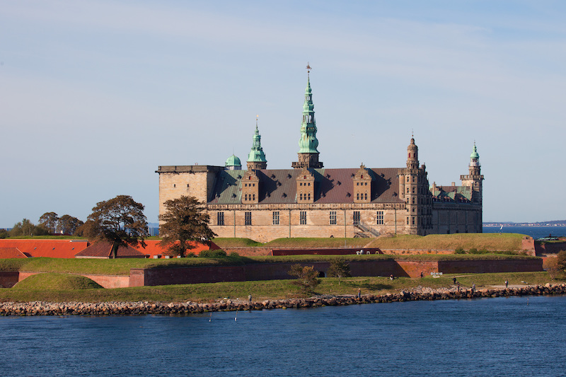 view of Kronborg Castle (Elsinore), Denmark, across a stretch of water on a balmy summer's day