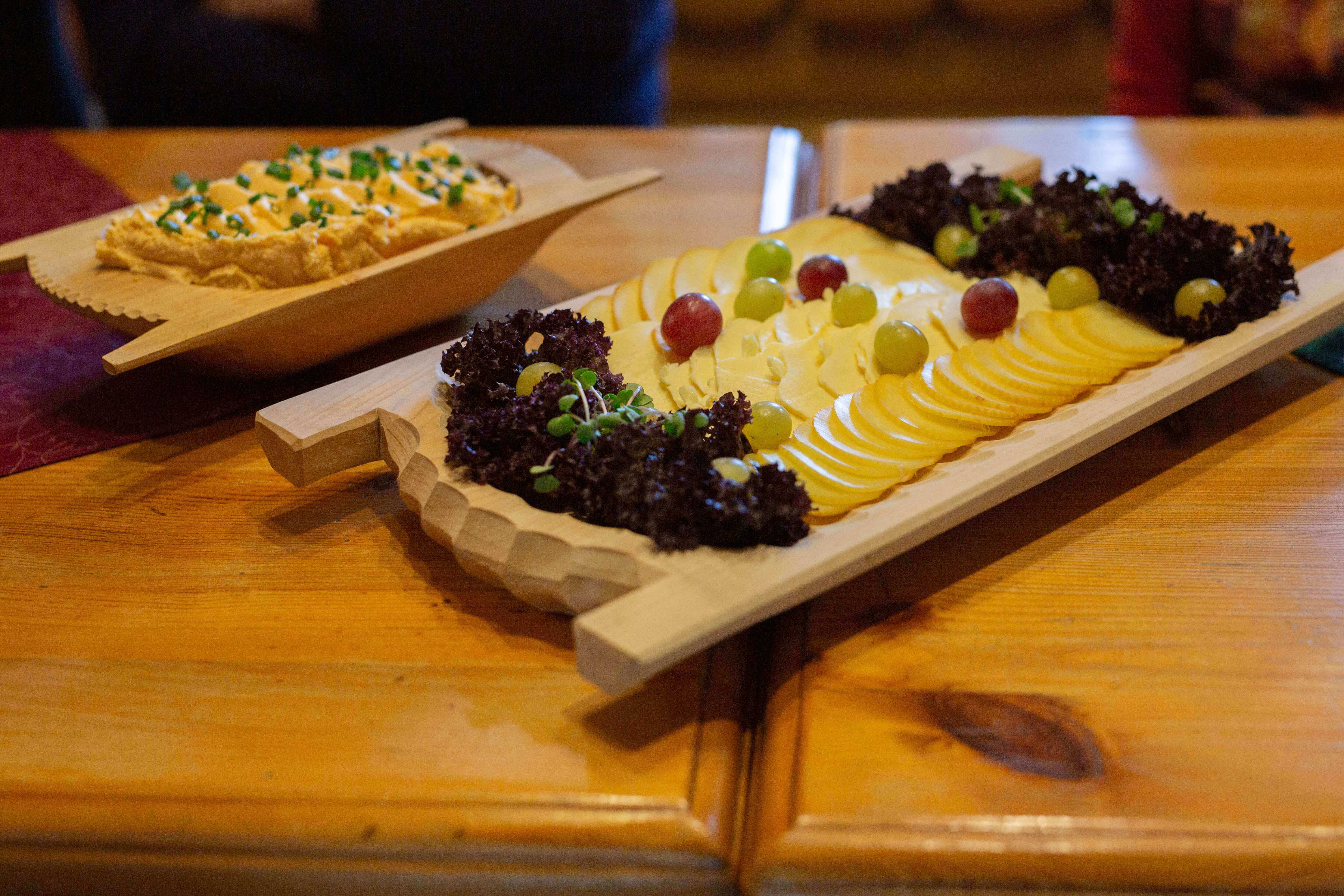 Cheese boards presented on long table at Slovakian tasting session