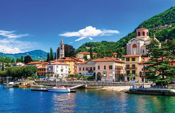 A coastal view of a lakeside town on Lake Maggiore, a lake connecting Northern Italy with Southern Switzerland.