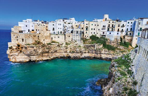 A coastal view of the hamlet of Polignano a Mare in Italy.