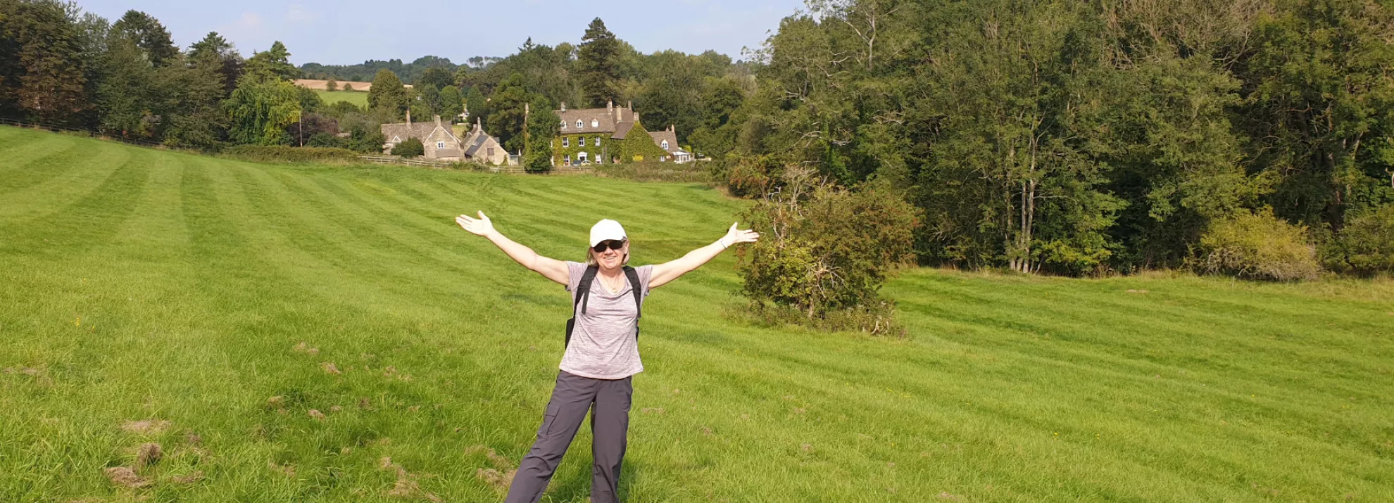 woman standing in green field 