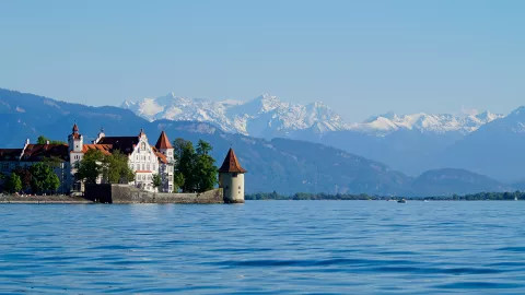 A view of a large manor on the Lake Constance waterfront.
