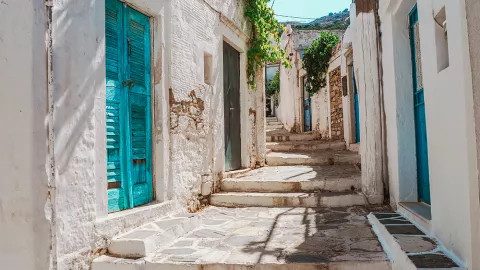 Stunning white and blue adorn the houses and cobbled streets of the Island of Naxos.