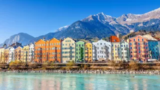 Colourful houses of the city of Innsbruck line the Austrian Coast.