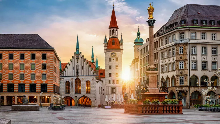 View of the sun setting over Marienplatz in Munich, Germany