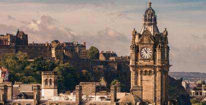 A view of the Edinburgh cityscape, with Castle Rock in the background.