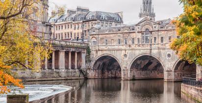 A flowing canal in the city of Bath.