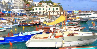 Rows of boats docked on the harbour of the town of Marina Grande.