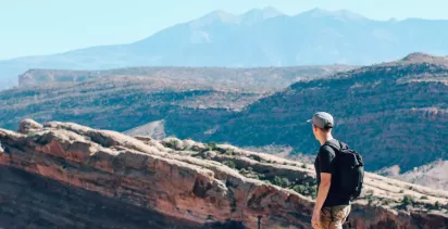 Man overlooking mountain view