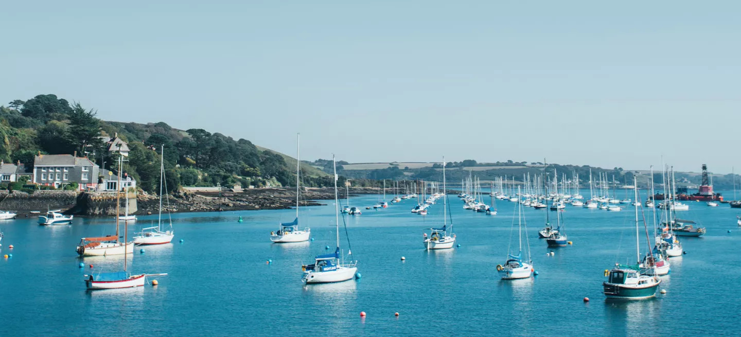 Boats anchored in St. Mary's Harbour, Isles of Scilly, England.