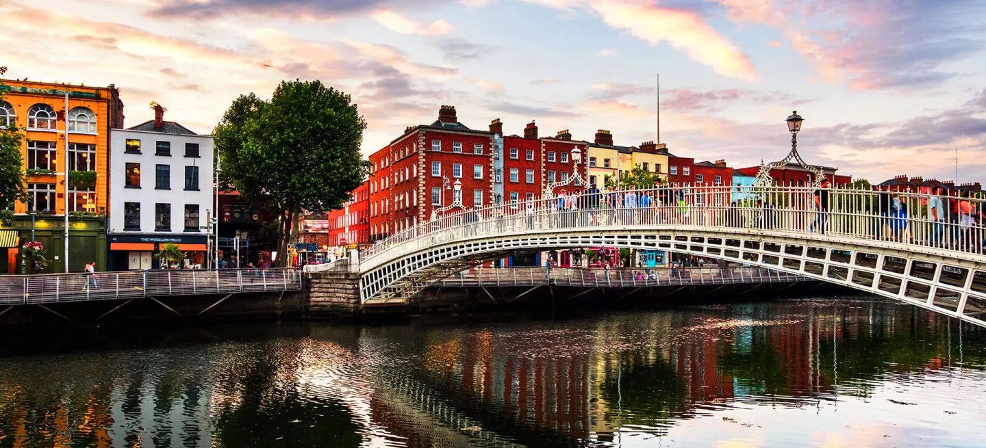View of the Ha’penny Bridge across the river Liffey in Dublin