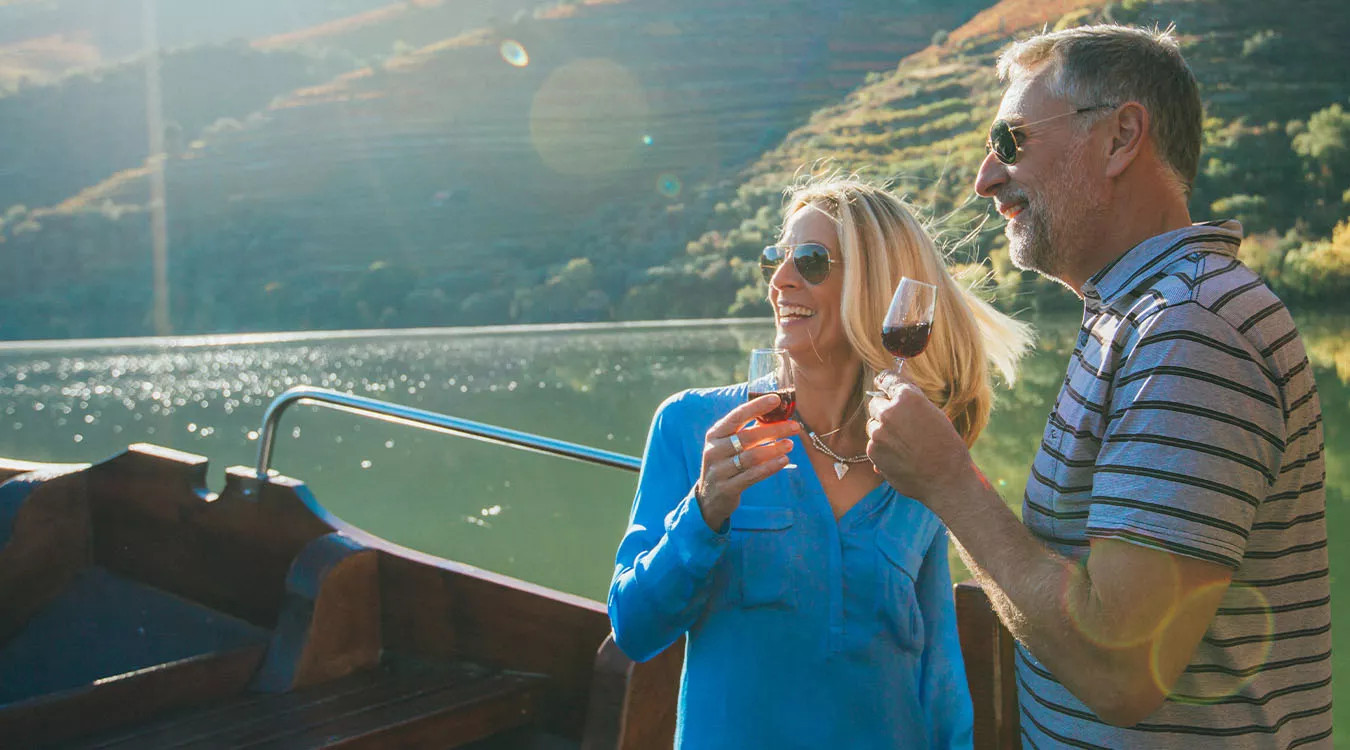 A couple enjoying some Portuguese wine in the Douro Valley