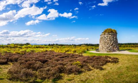 Sunny day historic battlefield stone memorial