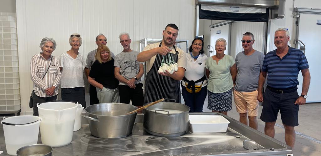 Group learning how to make mozzarella